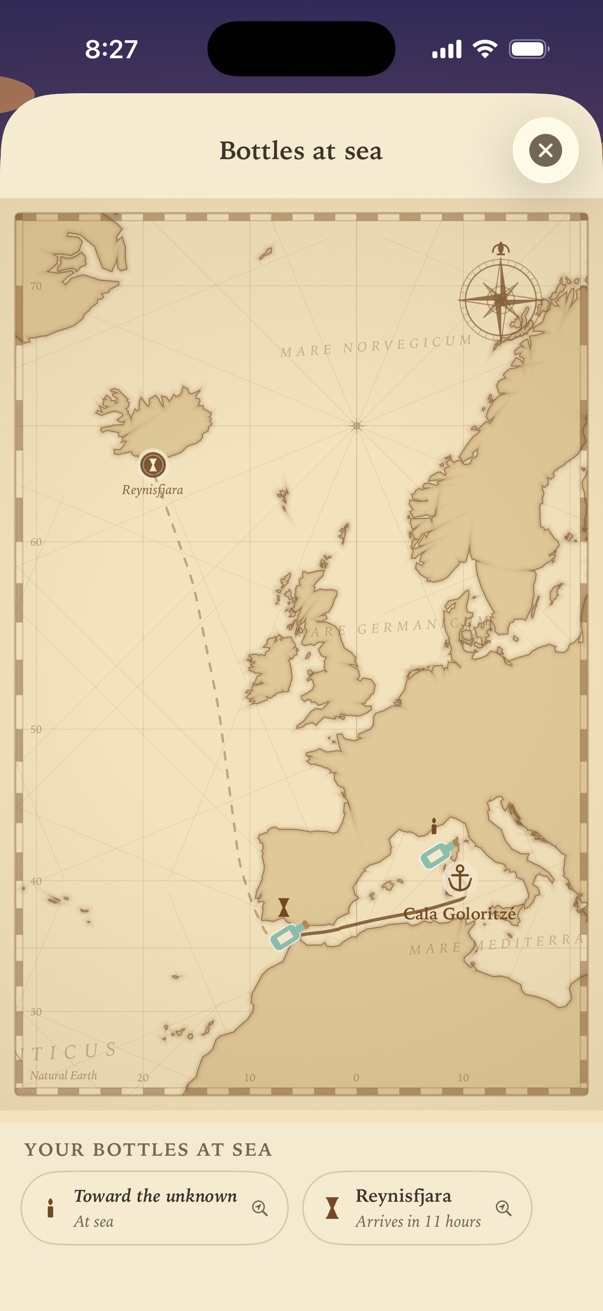 The nautical chart: a route drawn from Cala Goloritzé out of the Mediterranean and north across the Atlantic towards Iceland, with the bottle partway along it.